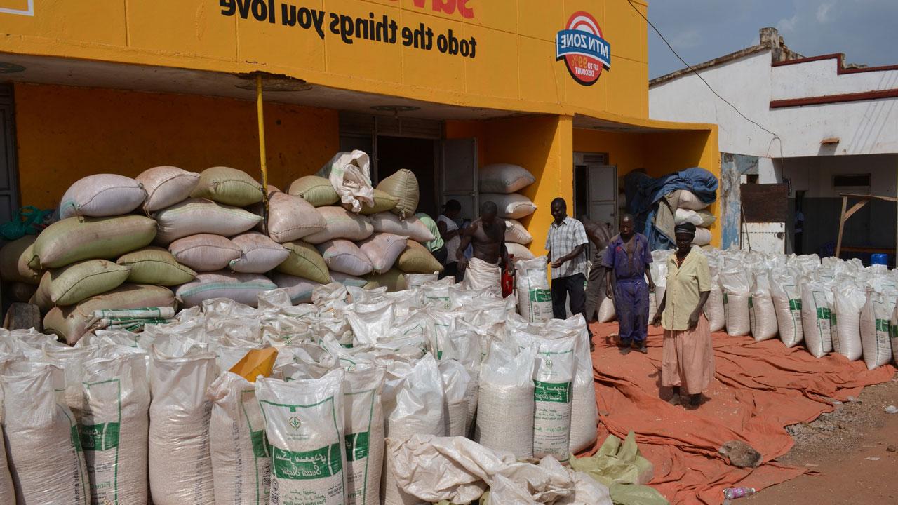 Pile of grain bags available for sale outside a store in Uganda